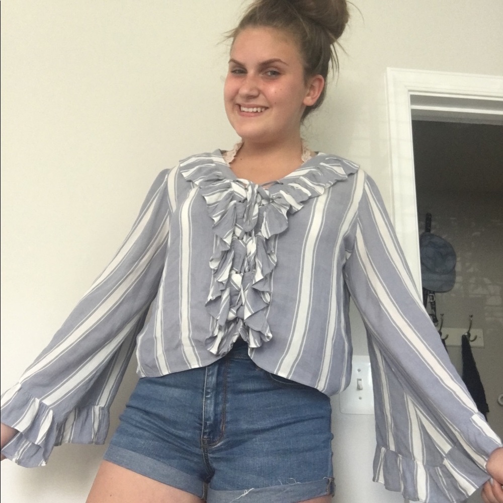 a blue ruffly shirt